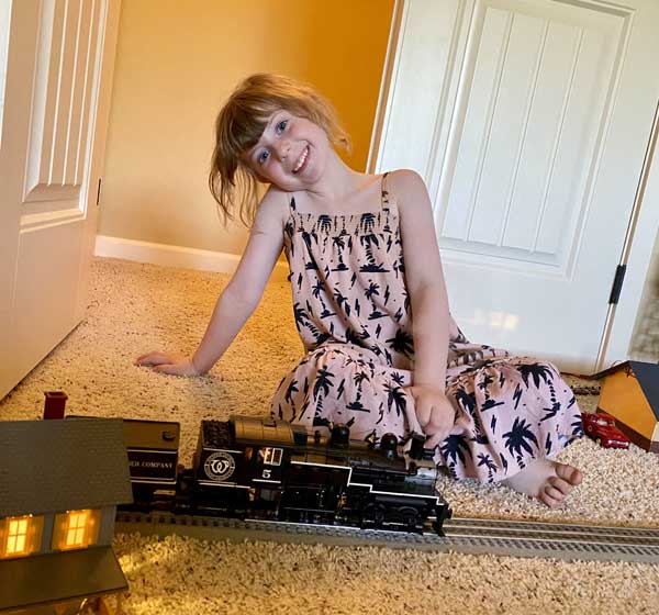 Skye with model of a 1904 Lima Shay Locomotive